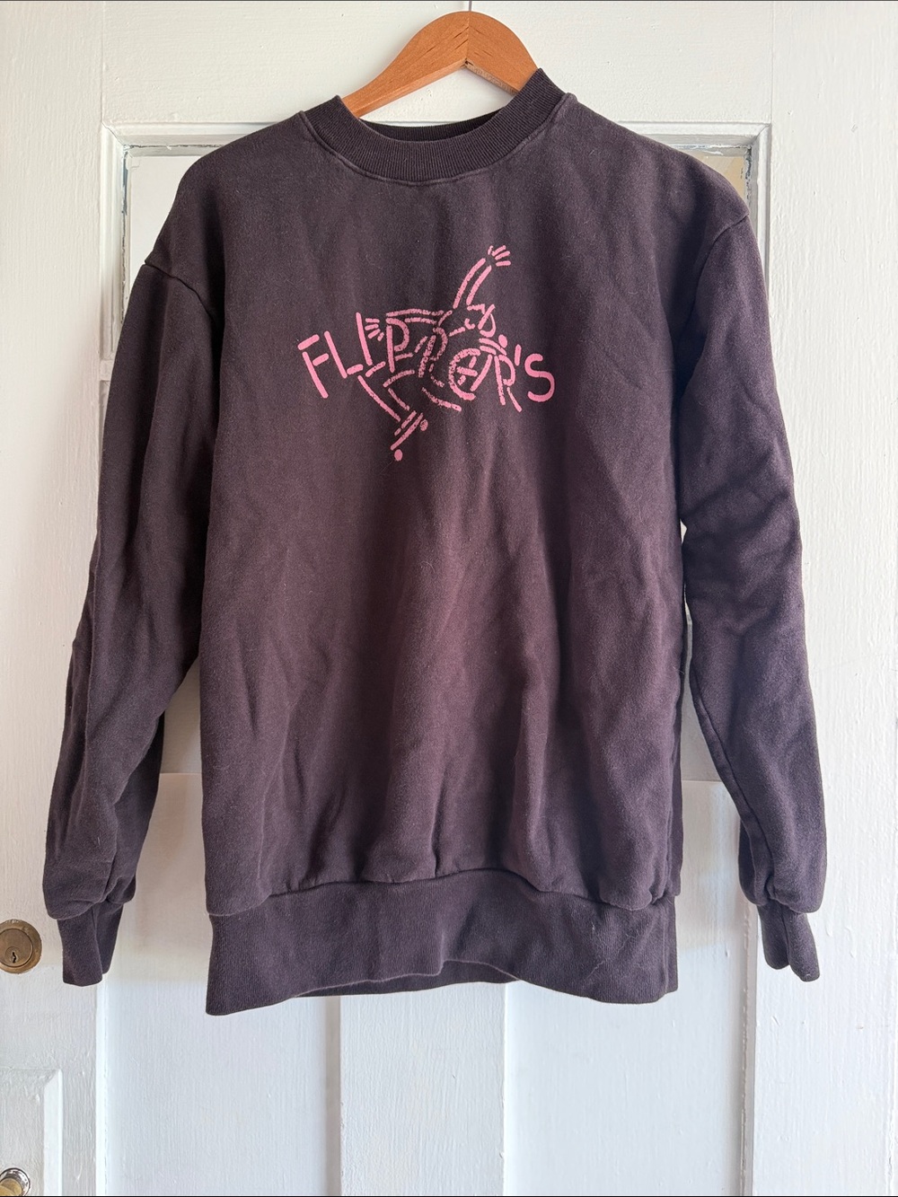 UNISEX S Flipper’s (Rockefeller Center) Black Crewneck Sweatshirt with Pink Logo